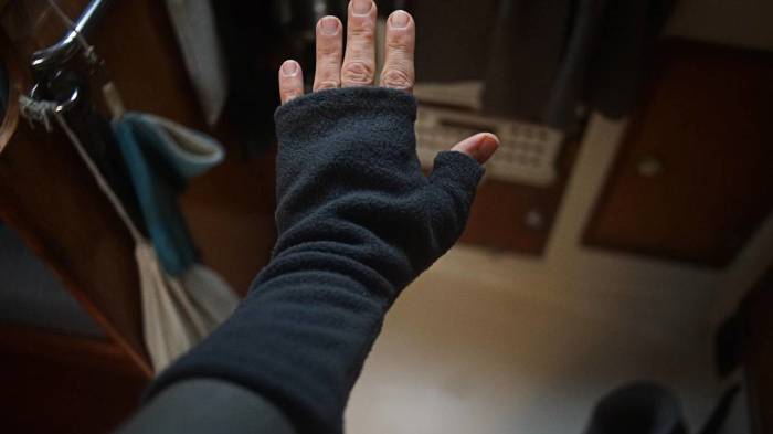 the outside of reks hand covered by an armwarmer